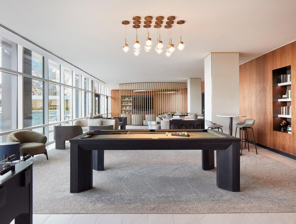 resident lounge with billiards table, seating spaces and entertainment area