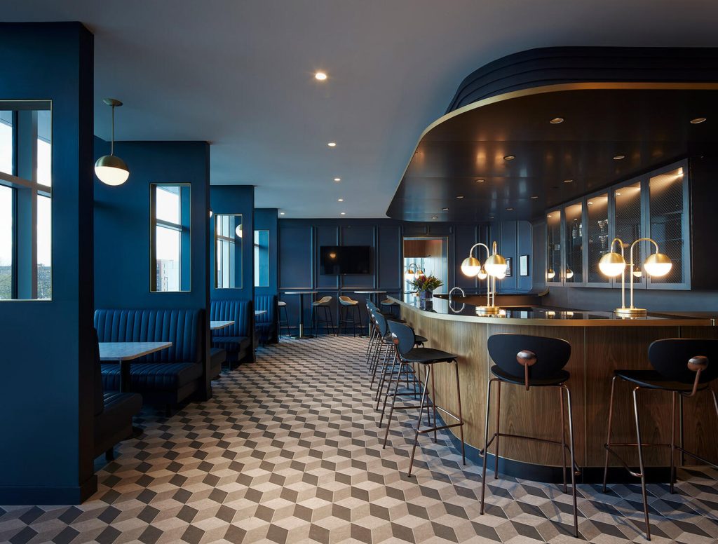 Gibson speakeasy with bar area and seating